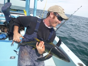 Capt. Charlie Ellis of Miami, FL releases a tagged yellowfin tuna