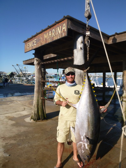 Capt. Charlie Ellis with a trophy yellowfin tuna caught fishing in venice, LA