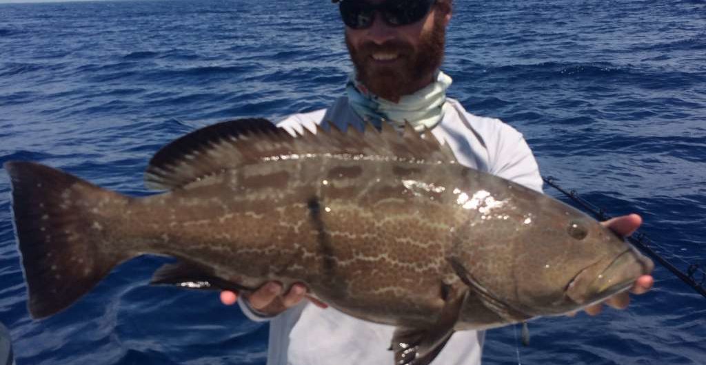 Capt. Charlie Ellis with a nice Miami Grouper