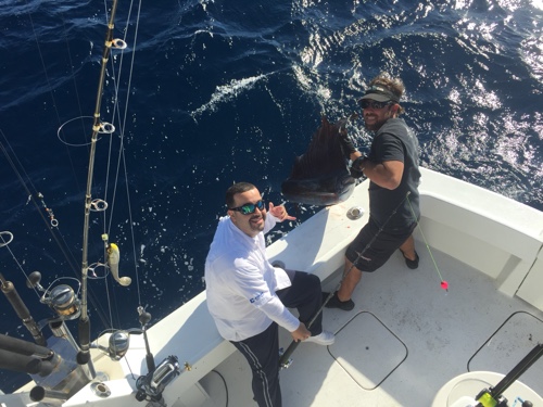 Capt Danny catching sailfish on the top gun