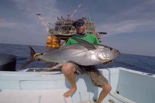 Scott Virgin with tuna at oil rig
